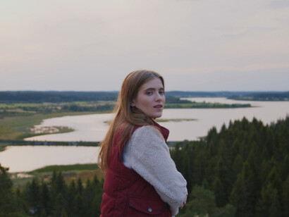 Surrounded by the beauty of nature, this woman is grateful for the balance of 'milk and honey' in her body, where brain and gut work together to enhance her happiness