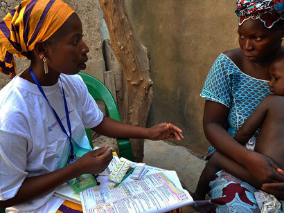 Delivery of malaria treatment by community health worker in Djénébougou, Mali. October 2013