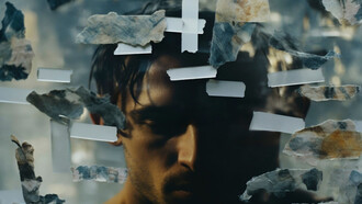 A man symbolizing the weight of humanity’s unhealed wounds and the repetition of past atrocities 