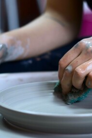 Craftsman making pottery