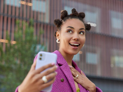 A young woman sharing a moment of emotion on her social media feed to a engage with followers 