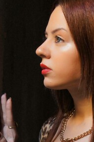 Hiba Outa looking out from her cell