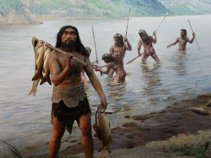 A detailed diorama depicting human life during the Late Paleolithic period