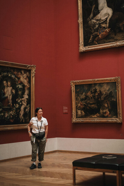 Munich, Bavaria, Germany, a woman looking at paintings in a museum