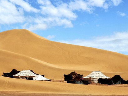 A group of traditional Berber tent in M'hamid El Ghizlane, highlighting the understated elegance of nomadic design