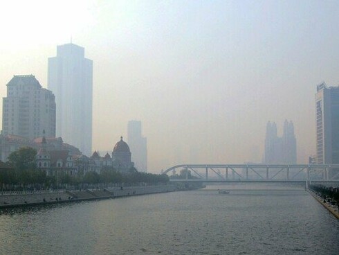 A hazy skyline reflects the environmental cost of decades of rapid economic growth in China