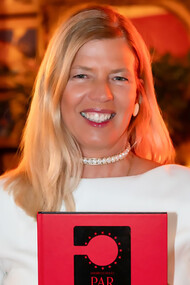 Elisabetta Dotto holding her third book