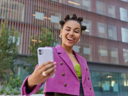 A young woman recording her daily activities and sharing content with followers