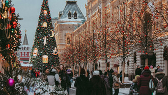 Urban Christmas decorations and a bustling shopping crowd in Moscow, Russia