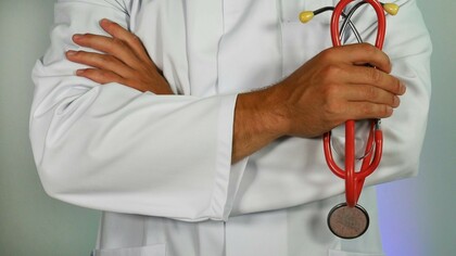A doctor with a stethoscope advocating for healthcare reform and equity in healthcare