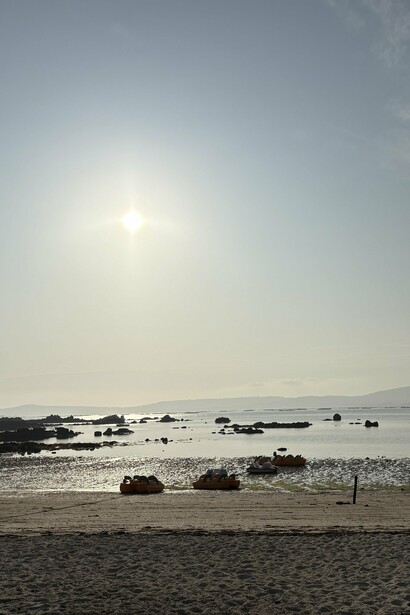 Golden light washes over the calm shores of Illa de Arousa © Photo by Noelle Newell