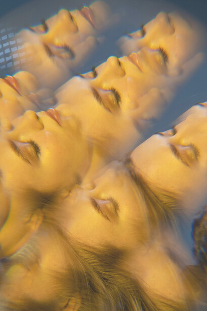 A warped portrait of a woman merges with the image of a maze, symbolizing the journey of self-orientation and the search for meaning within a fragmented world