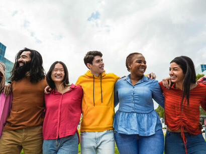 Friends from different cultures and faiths sharing joyful moments—showing that diversity brings us closer