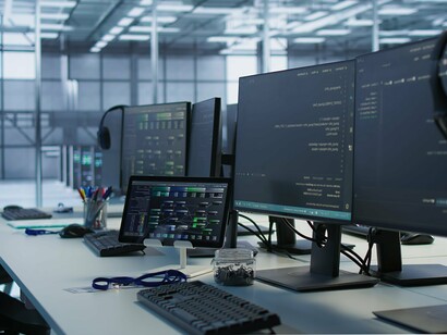 Desks once filled with people now serve the quiet efficiency of machines