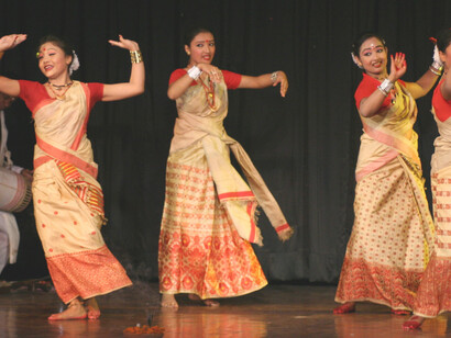 Originating from Assam, the Bihu dance is a lively folk tradition performed during the Bihu festival to mark the arrival of spring. Young men and women move with energetic steps, swift hand gestures, and rhythmic hip movements that capture the essence of youth and celebration, adorned in bright, traditional Assamese clothing