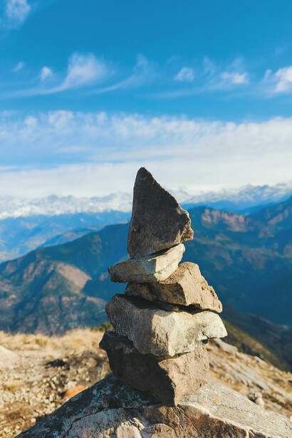 Stacked stones overlooking the Himalayan mountains