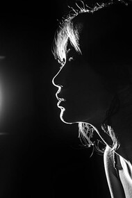 Looking out into the distance, she contemplates the deeper dimensions of pleasure that extend beyond physical sensations and touch