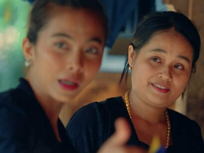 Two women talking, capturing the communal bonds that hold Baduy society together