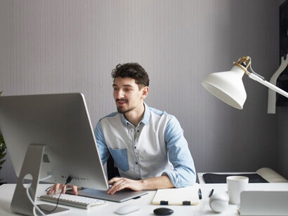 A remote worker experiencing screen fatigue during extended laptop use