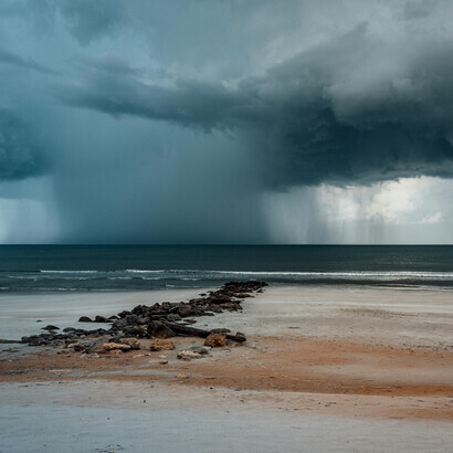 Dark storm clouds loomed above the sea, signaling the arrival of a cyclone