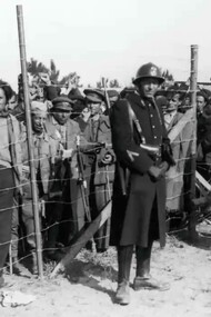 Spanish refugees, mainly republicans and members of the International brigades are guarded by French troops at a camp on Argeles beach in 1939.