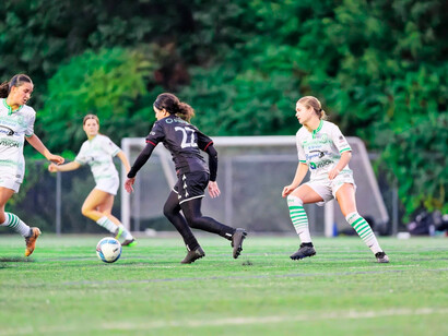 Two football team engaged in a fast-paced game, illustrating sport as a tool for diplomacy through contest and spectacle