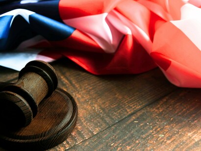 The flag and the gavel: two instruments shaping the American experiment