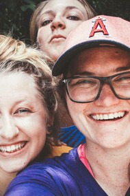 A group of friends in good spirits and expressing their happiness