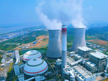 Power plant with large smokestacks in Jiujiang, Jiangxi, China, highlighting the region’s industrial capacity and environmental challenges