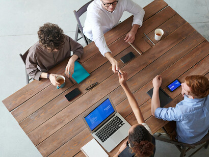 Group of professionals, including women, collaborating on technology projects and addressing gender bias in data