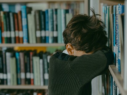 A dejected child feeling unseen and unheard, reflecting how this can result in a lack of connection with others and a strong desire for approval 