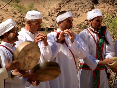 Men playing instruments as part of Ahwash, which often involves dance, singing, poetry, and percussion
