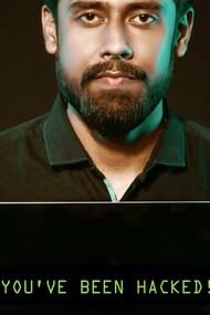 Man with a laptop suggesting that 'you have been hacked'