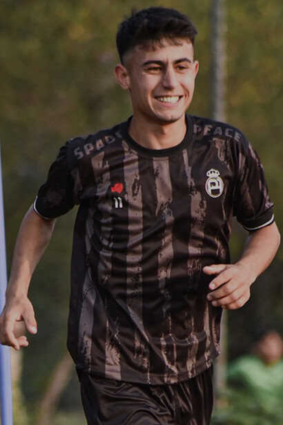 A young footballer practices under the floodlights in Lahore, embodying the nation’s renewed spirit for the game