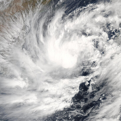 On May 11, 2003, NASA’s Aqua satellite, equipped with the MODIS instrument, captured a striking bird’s-eye view of Tropical Cyclone 01B churning over the Bay of Bengal
