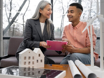 An architect and project manager integrating alternative energy solutions into real-life building plans