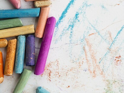 A child’s world in fragments: crayons, paper, and the promise of stories yet to be drawn