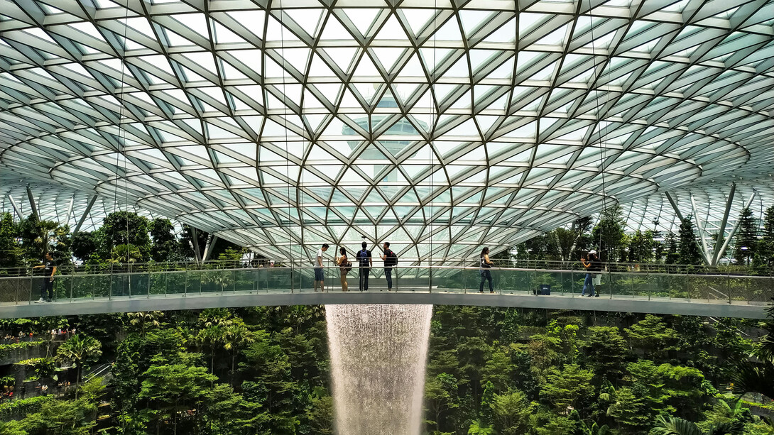 The lush interior of Jewel Changi Airport in Singapore, blending nature with modern architecture
