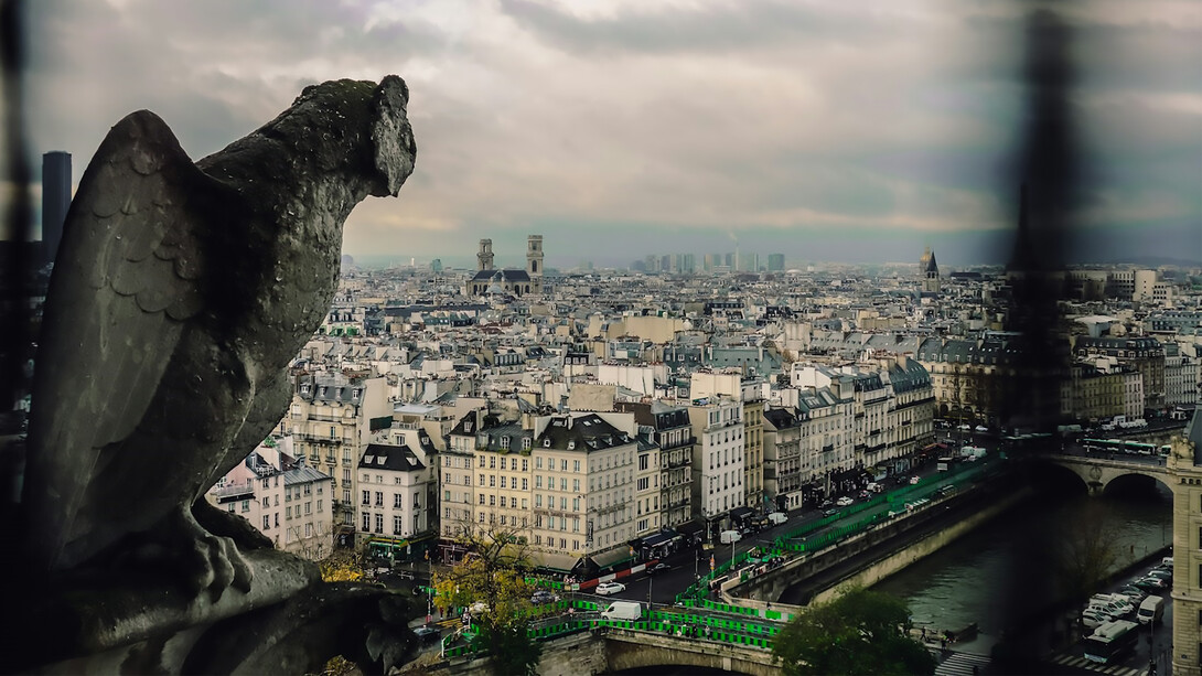 A stunning view of Paris from a window, showcasing the city's iconic landmarks