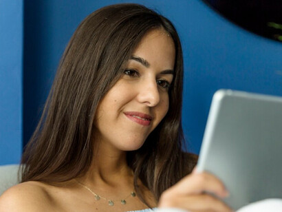 A young woman immersed in screen time—highlighting the digital habits of modern life