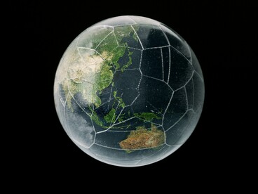 A world that is seemingly intact but filled with cracks, hinting at the divided world as the competition between geopolitical blocs intensifies