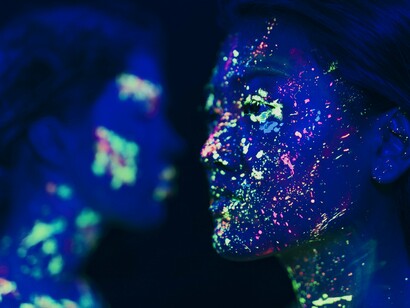 Faces glowing with electric colour, reflecting how heightened perception shape every interaction