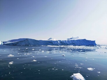 The iceberg illustrates the effects of rising global temperatures, as increased ocean heat accelerates ice melt