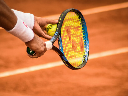 A detailed view of the racket and the player's grip