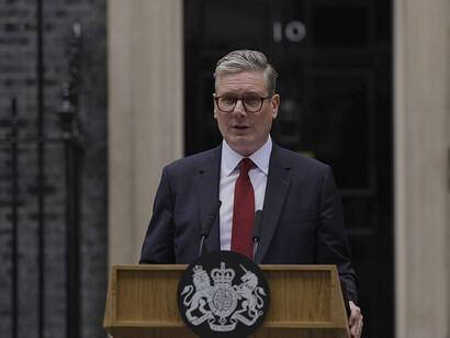 In London, United Kingdom, Prime Minister Sir Keir Starmer and his wife Victoria arrive at Number 10 Downing Street, addressing the public with a speech on his first day in office
