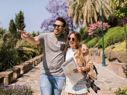 A couple pointing ahead while holding a map, wandering in Thailand and its hidden gems 