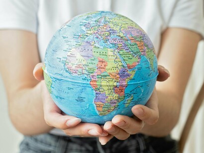 The globe in our hands reflects the truth: we are one humanity facing one destiny