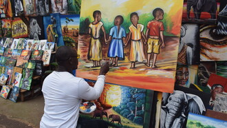 Canvas painting at the African Craft Village offers a vibrant display of local creativity
