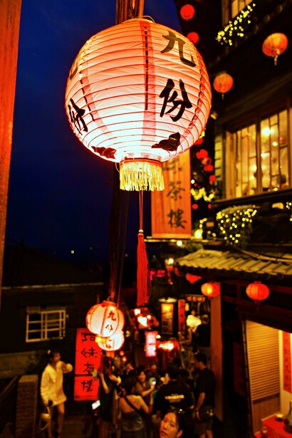 A traditional lantern glowing at dusk in Jiufen, Taiwan 