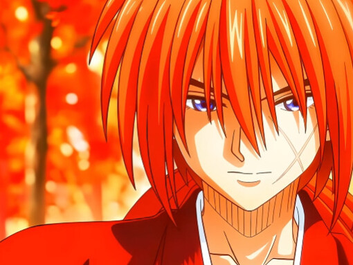 Kenshin stands in a blazing autumn forest, his red haori mirroring the fiery leaves that surround him